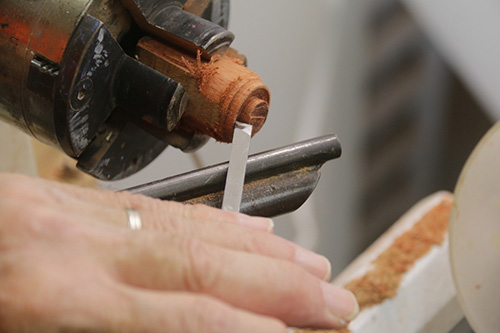 Creating top finial piece from lower finial waste