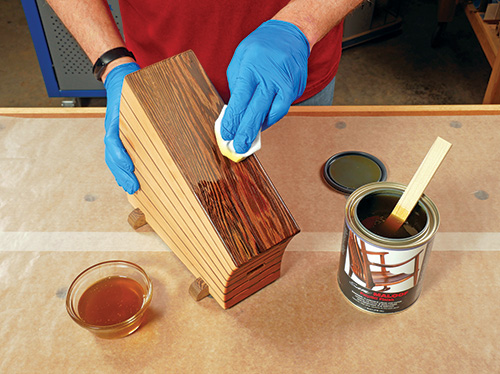 Spreading an oil and wax finish on a knife block